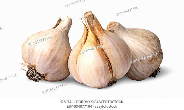 Three bulbs of garlic beside isolated on white background
