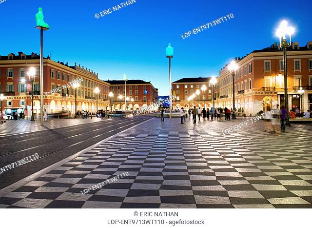 France, Provence Alpes Cote dAzur , Nice. A dusk view of the Place Massena and Galeries Lafayette in Nice