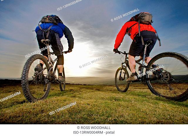 Two mountain bikers riding together