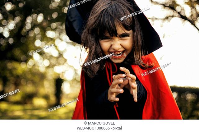Portrait of little girl masquerade as vampire