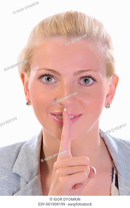 Beauty female with her finger to her mouth gesturing for quiet