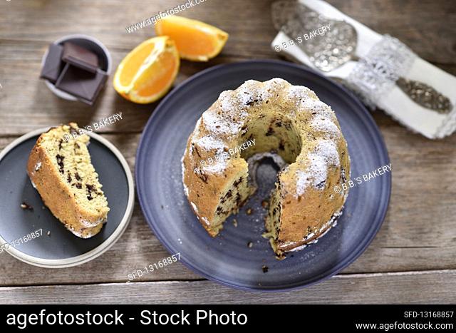 Vegan chocolate-orange Bundt cake with icing sugar, sliced