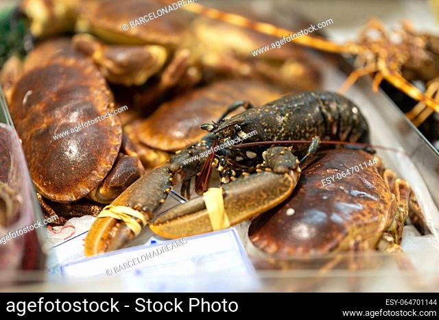 Newly caught lobsters and crabs are sold on the market. Mid shot