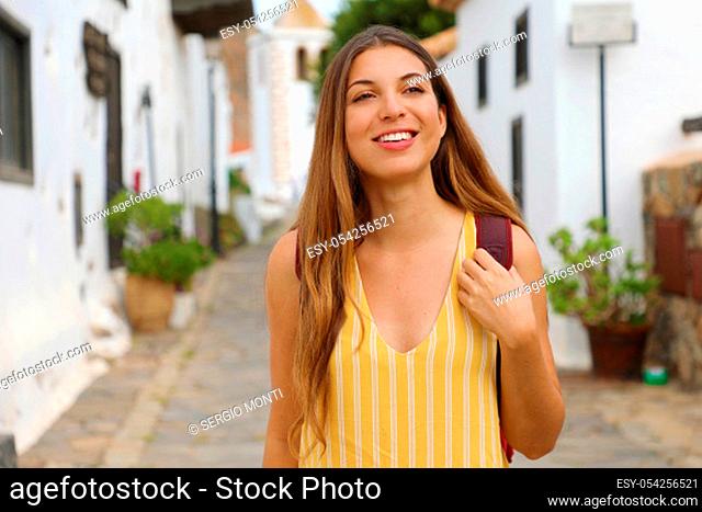 Young traveler girl visits small colonial town of Betancuria, Canary Islands, Spain
