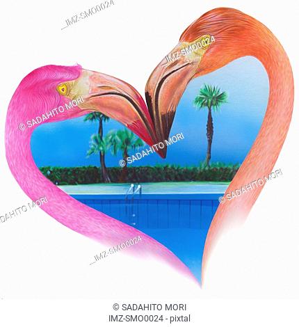 View of beach through heart shape formed by two flamingos
