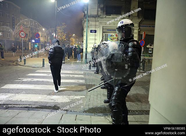 Illustration picture shows police, as small riots break out, in the streets of Brussels city center, after Morocco lost the semi-final match of Morocco vs...