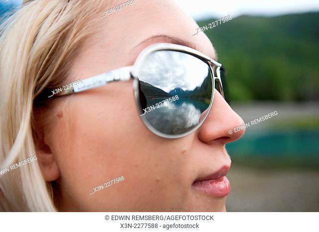 Landscape reflected in sunglasses by lake Eklutna Alaska