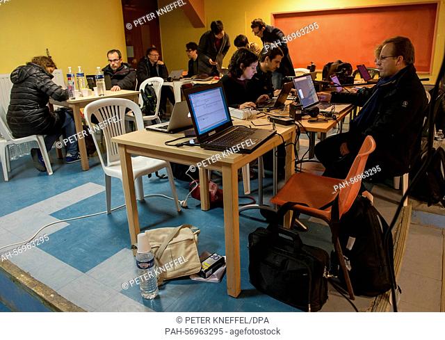 Journalists sit in the press centre as they report from the operations centre near the crash site of an Germanwings A320 aircraft in Seyne Les Alpes, France