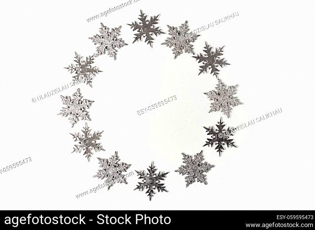Silver Christmas ornament snowflake on white background top view. Christmas and Holidays greeting card, frame. New Year. Noel
