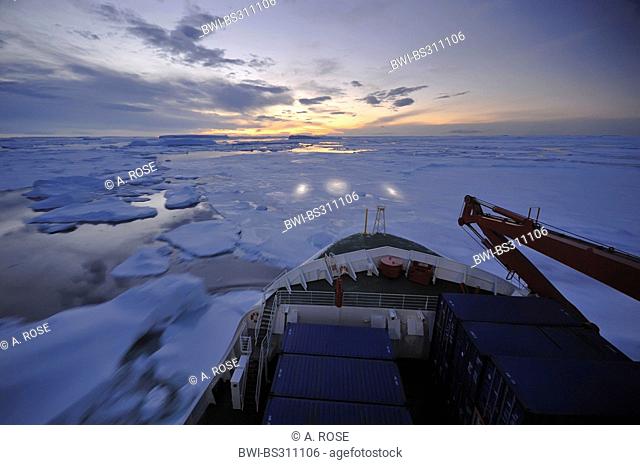 ship breaking a passage through the pack ice near Ross Island, Antarctica