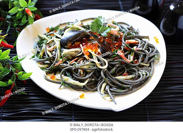 Squid ink pasta with seafood and caviar