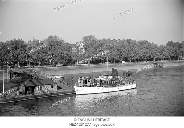 River cruiser at Cadogan Pier, London, c1945-c1965. A river cruiser halts at Cadogan Pier on the River Thames at Chelsea, London