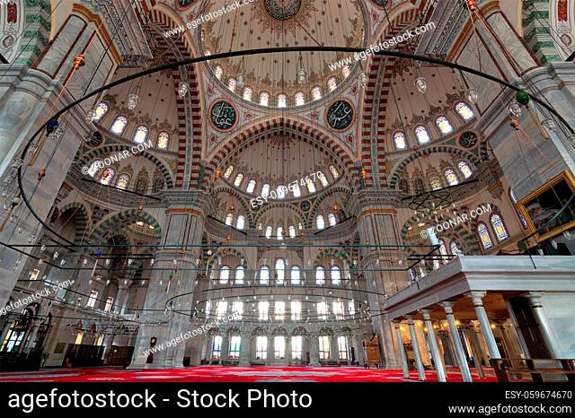 Fatih Mosque, a public Ottoman mosque in the Fatih district of Istanbul, Turkey, with a huge decorated domes many colored stained glass windows