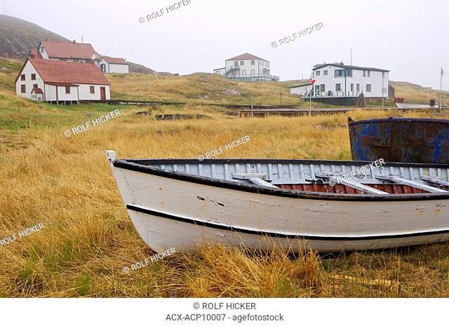 An old fishing boat hauled out on the shore at Battle Harbour, Battle Island at the entrance to the St Lewis Inlet, Viking Trail, Southern Labrador