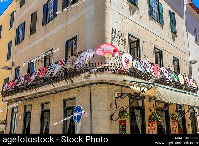 Corner house with balcony decorated with fans, old town, Mahon, Mao, Menorca, Spain, Europe