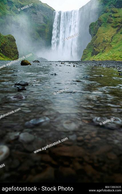 Famous and most visited Skogafoss waterfall in Iceland at evening light