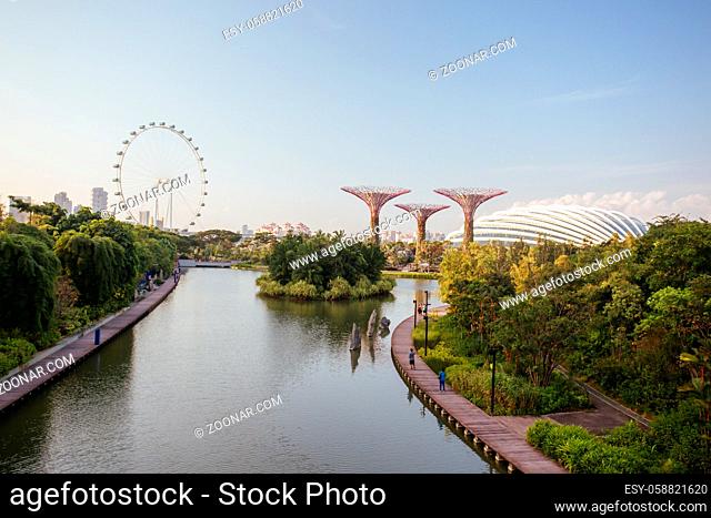 Marina Bay, Singapore - 23rd June 2015: Early evening view of the Supertrees Grove, and Cloud Forest Flower Dome at Gardens by the Bay