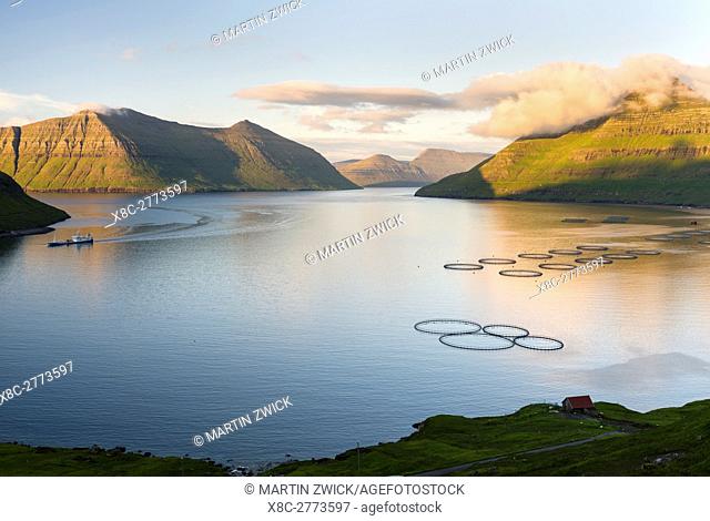 Fjord Fuglafjordur and Leirviksfjordur at sunset, in the background the mountains of the island Kalsoy. The island Eysturoy one of the two large islands of the...