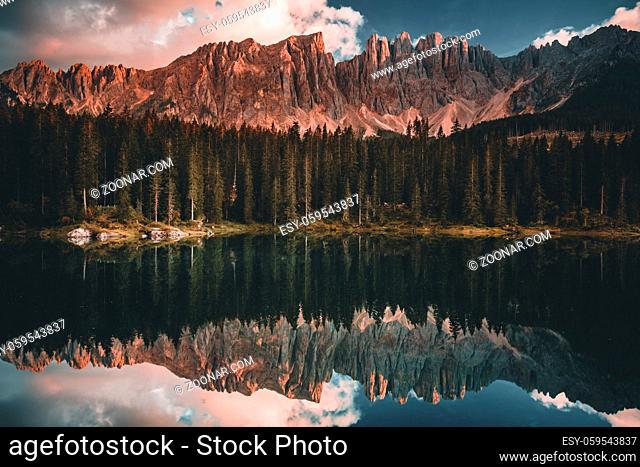 Carezza lake Lago di Carezza and Mount Latemar in Dolomites Alps . Italy