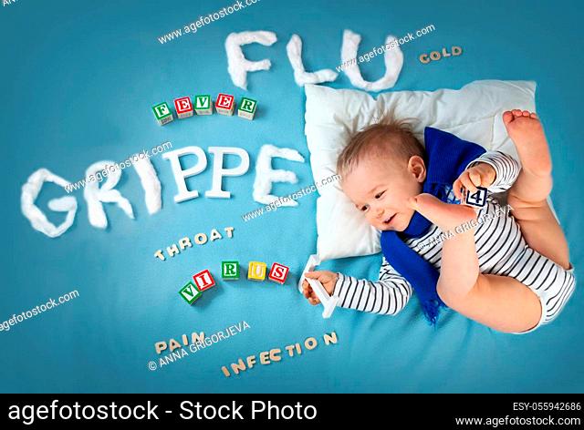 Ill boy lying in bed. baby with grippe text