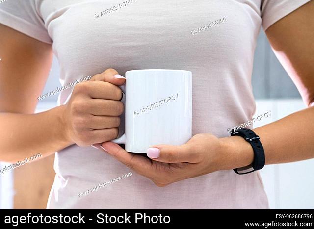 Woman Holding Coffee Mug Or Cup Mockup