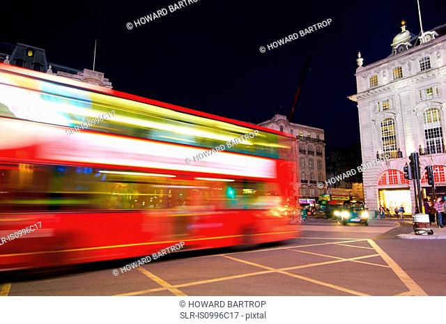 Bus in motion on Piccadilly Circus, London, UK