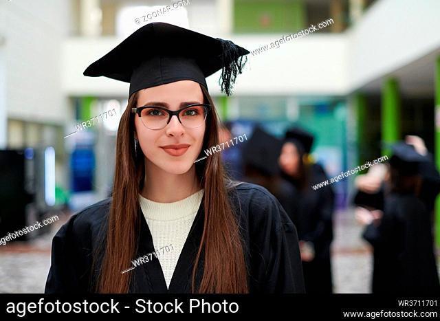 Happy woman portrait on her graduation day University. Education and people