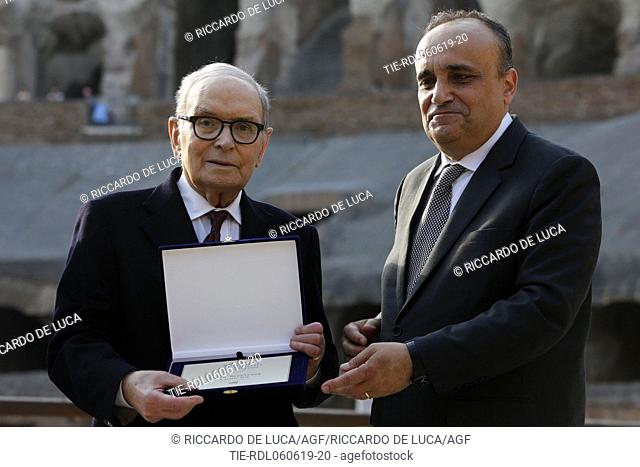 Italian composer and Academy Award winner Ennio Morricone (L) receives the 'Presidio Culturale Italiano' award from the Italian Minister of Cultural Heritage...