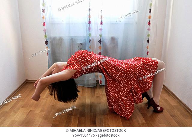 Young woman levitating