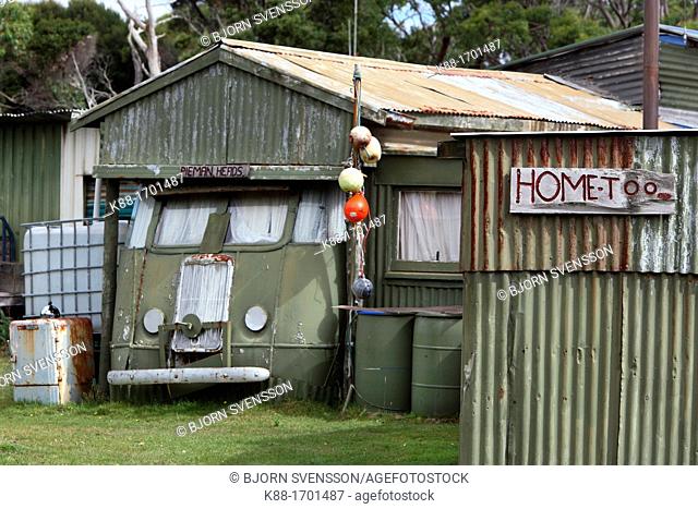 Beach shacks at Pieman Heads  North West Tasmania, Australia