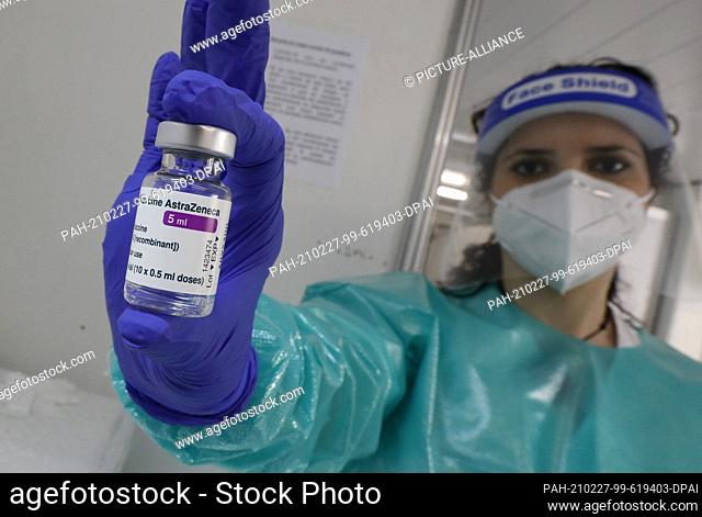 27 February 2021, Spain, Palma: A nurse shows the AstraZeneca vaccine used at the ""Covid Express"" vaccination centre at Son Dureta Hospital