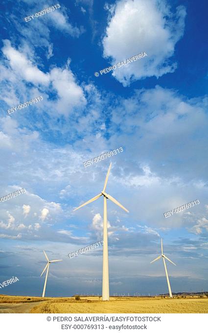 windmills group with cloudy sky in Gurrea de Gallego, Huesca, Aragon, Spain