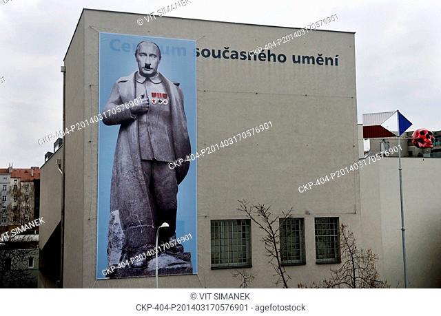 Giant protest billboard with caricature of Vladimir Putin pictured on the building of the Centre for Contemporary Art in Prague, Czech Republic on March 17