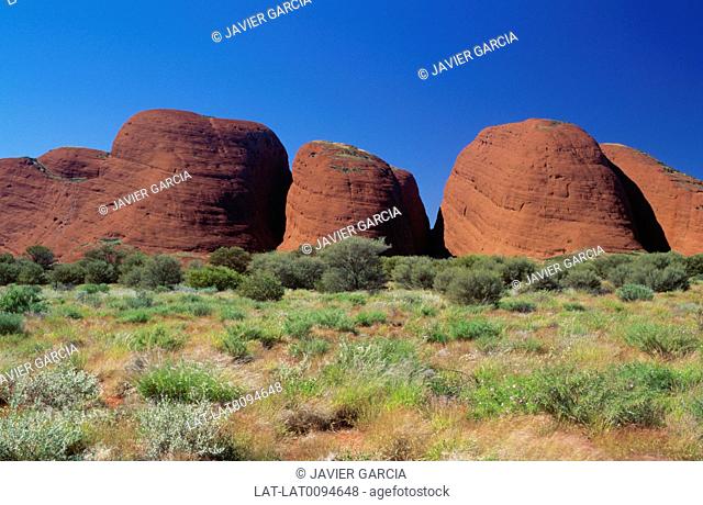 Kata Tjuta, also known as Mount Olga or colloquially as The Olgas, are a group of large domed rock formations located about 365 km southwest of Alice Springs