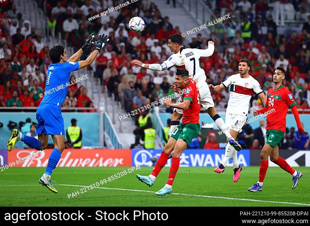 10 December 2022, Qatar, Doha: Soccer, World Cup, Morocco - Portugal, final round, quarter-final, Al-Thumama Stadium, Morocco's goalkeeper Bono saves a header...