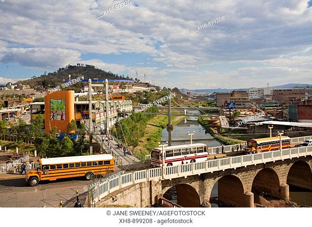 Honduras, Tegucigalpa, Buses crossing Bridge over Rio Choluteca, Mercada La Isla, La Isla Market, National stadium, Estadio Nacional, Tiburchio Carias Andino