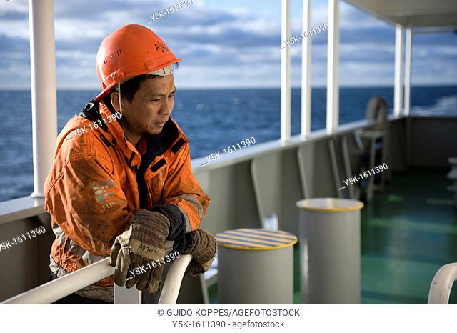 Portrait of an Indonesian seaman or sailor on the container-vessel MV Flintercape, during a journey from Rotterdam, Netherlands, to Sundsvall, Sweden