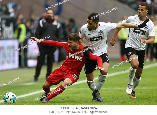 Koeln's Salih Oezcan (L) and Frankfurt's Simon Falette (M) and Timonthy Chandler fight for the ball at the Commerzbank Arena in Frankfurt am Main, Germany