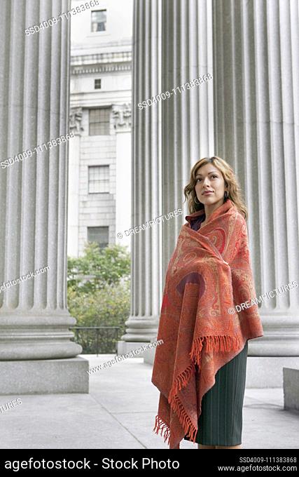 Hispanic woman in shawl standing outdoors