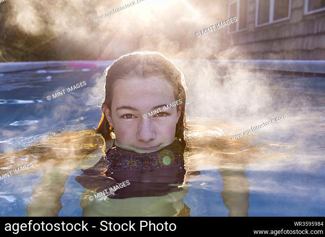 13 year old girl swimming in a pool