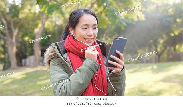 Woman making live stream at outdoor park
