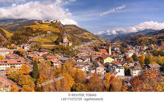 Panoramic view of the Eisacktal over the rooftops of the city Klausen with the castle Branzoll and the parish church in the autumn, Alps, Alto Adige, Dolomites