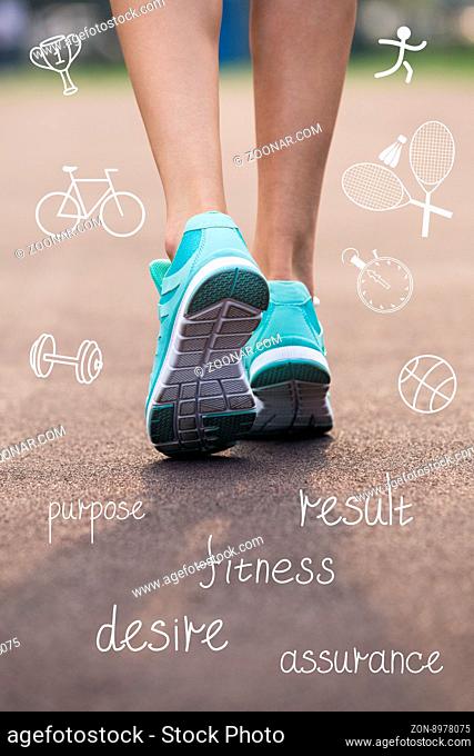Woman feet in sneakers with sport icons. Fitness concept