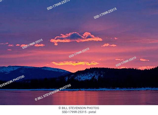 Sunrise over a mountain range, Donner Lake, California, USA