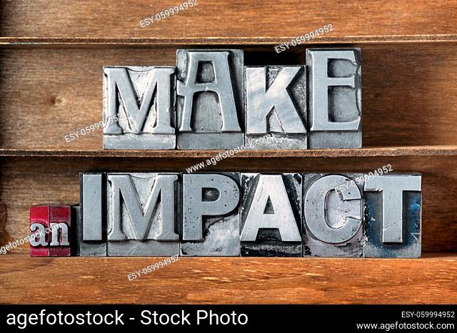 make an impact phrase made from metallic letterpress type on wooden tray