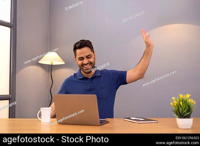 Male freelancer using laptop At Home Office