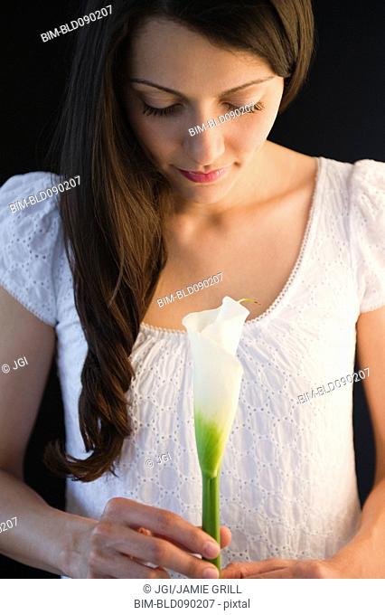 Brazilian woman holding calla lily