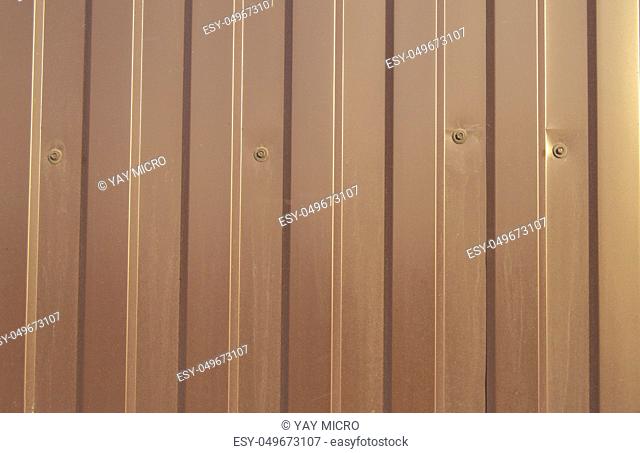 Brown metal siding, modern finishing material for the manufacture of fences and exterior wall cladding