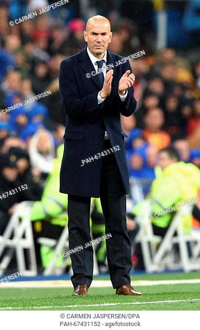 Head coach Zinedine Zidane of Madrid applauds during the UEFA Champions League quarterfinal second leg soccer match between Real Madrid and VfL Wolfsburg at the...