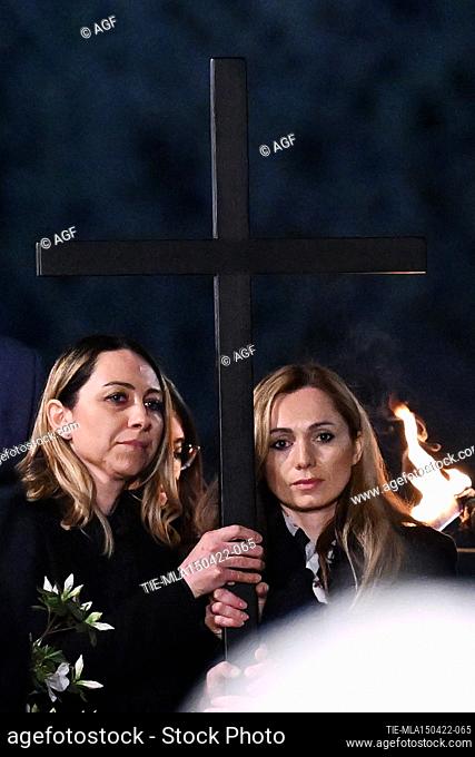 Torchlight procession of the Via Crucis to the Colosseum for Good Friday. Irina and Albina, from Russia and Ukraine, carry the cross during the Via Crucis